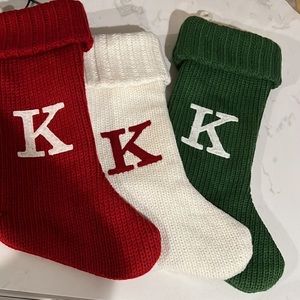 Three Wondershop initial Christmas stockings.